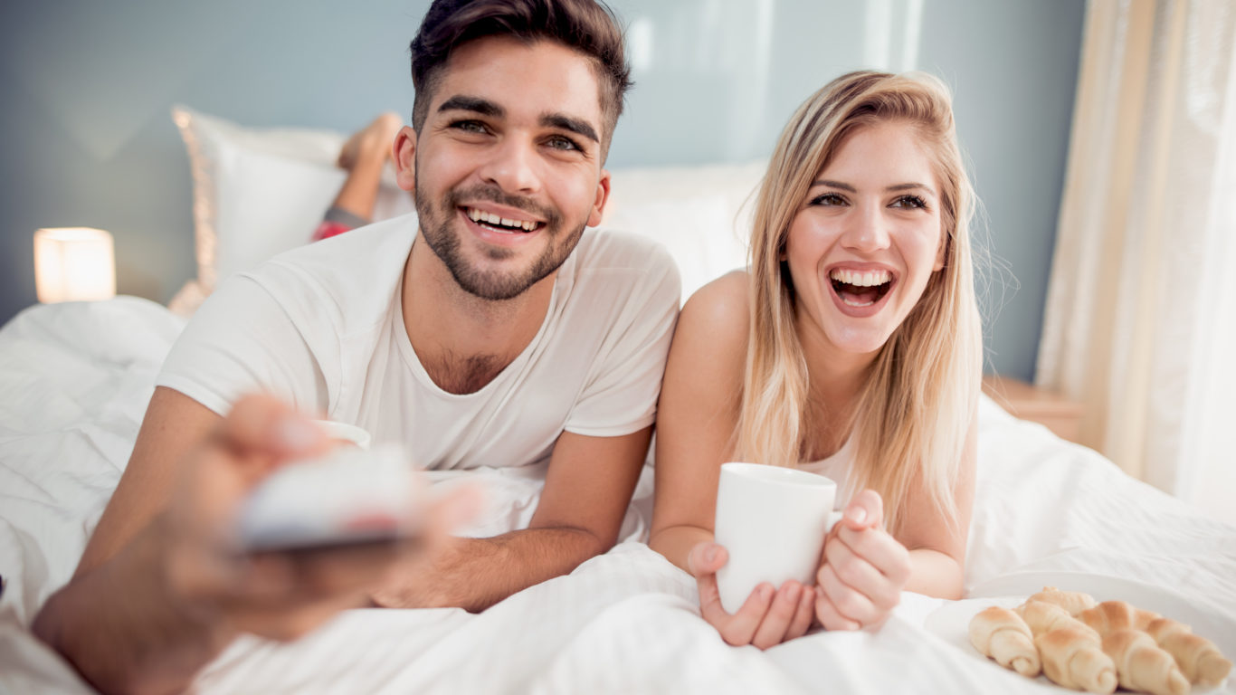 Cute couple watching TV