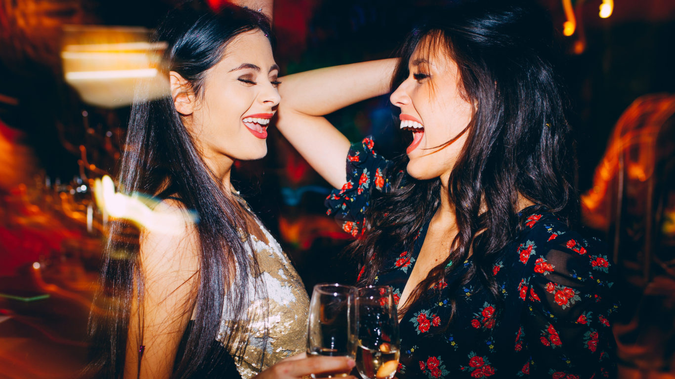 Two girls having fun at the club on New Year’s party