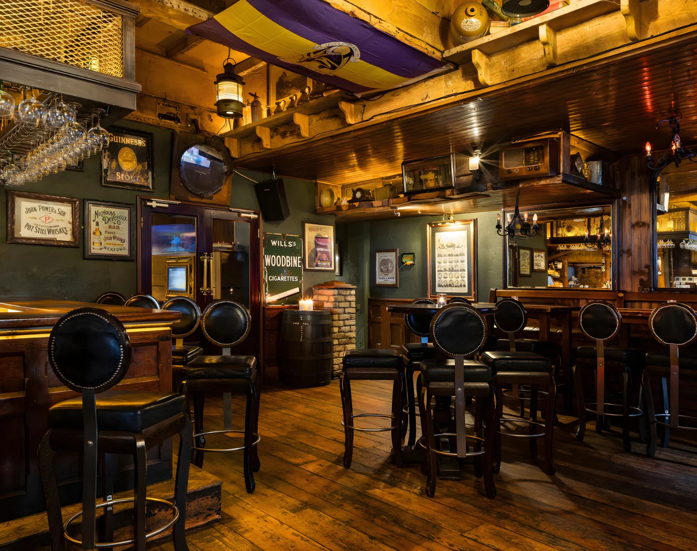 Cosy hotel pub with wooden decor, ambient lighting, and comfortable seating. Enjoy a relaxing drink and social atmosphere.